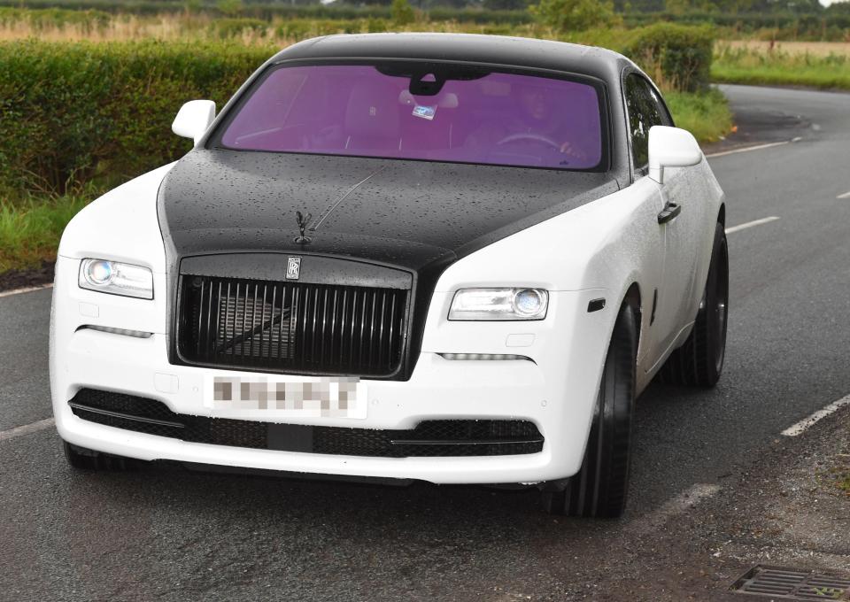  Lukaku has a £250,000 Rolls-Royce Wraith which he has had re-wrapped at leas three times - it is currently black and red (top)