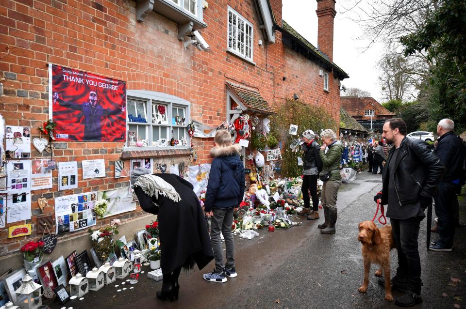  Fans gather on the anniversary of George's death in his home in Goring-on-Thames, Oxon, on Christmas Day 2016