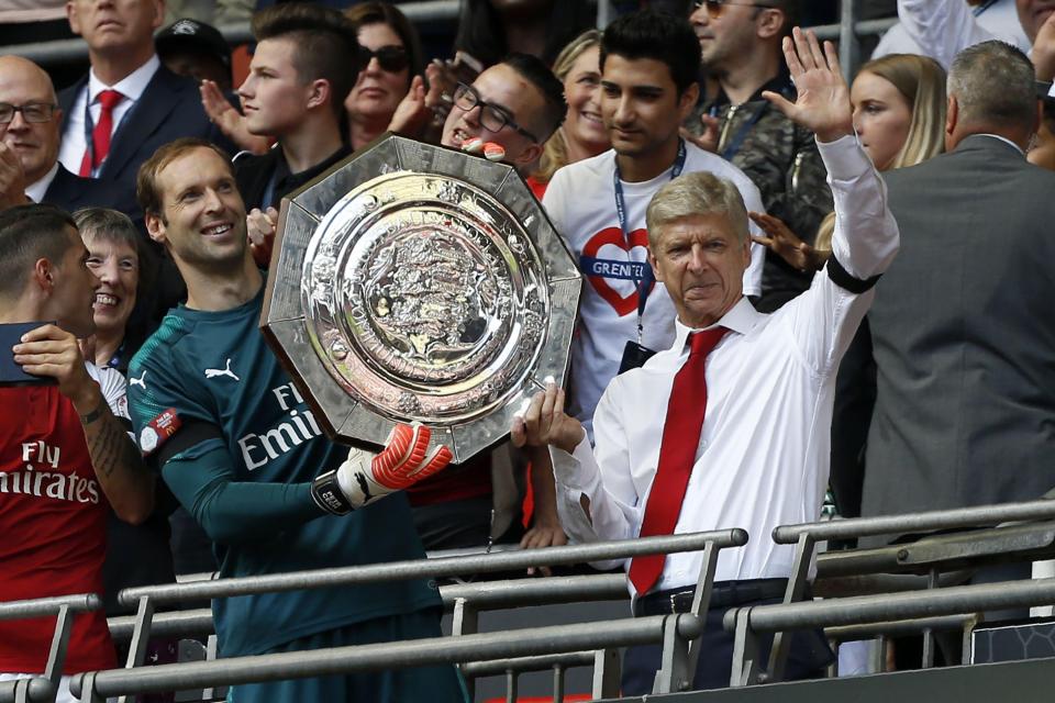  Petr Cech, left, and Arsene Wenger celebrate Community Shield success last year