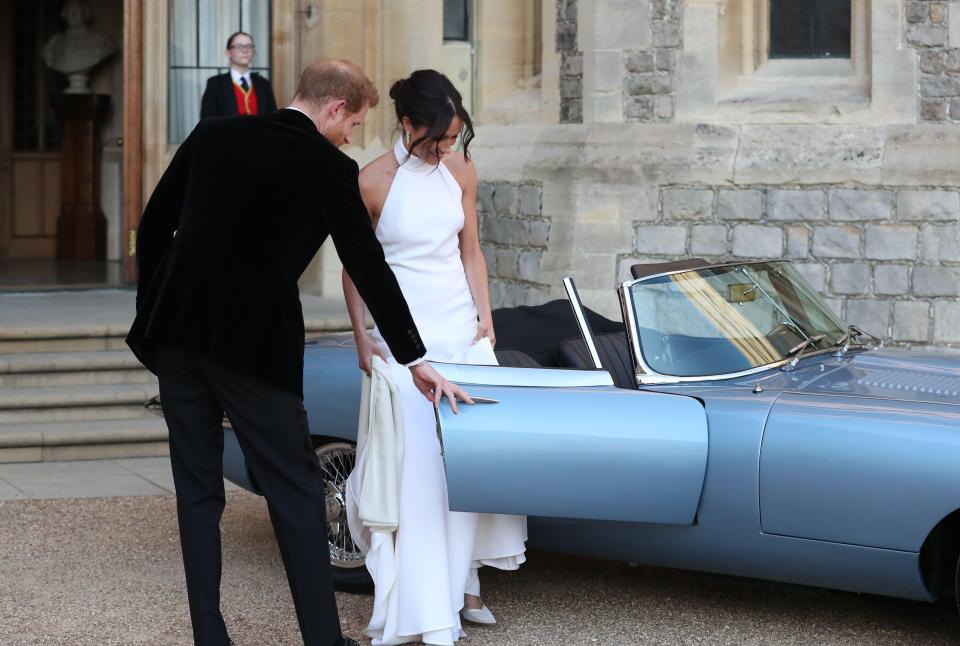  Prince Harry with Meghan leave their wedding in an electric E-Type Jaguar