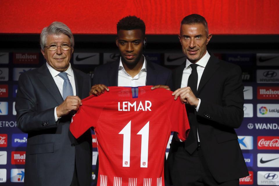  Andrea Berta, right, after he helped Atletico Madrid sign Thomas Lemar