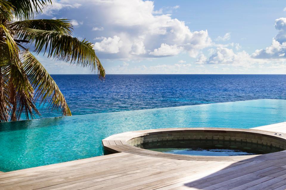  Each villa comes with its own vast infinity pool