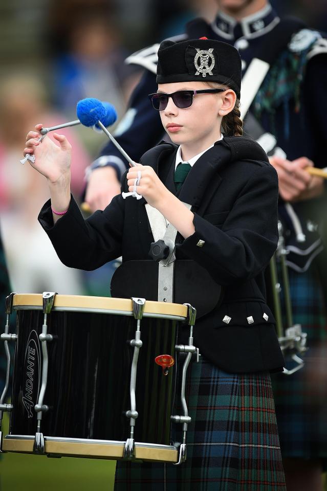  A drummer performs during the Massed Pipe Band parade