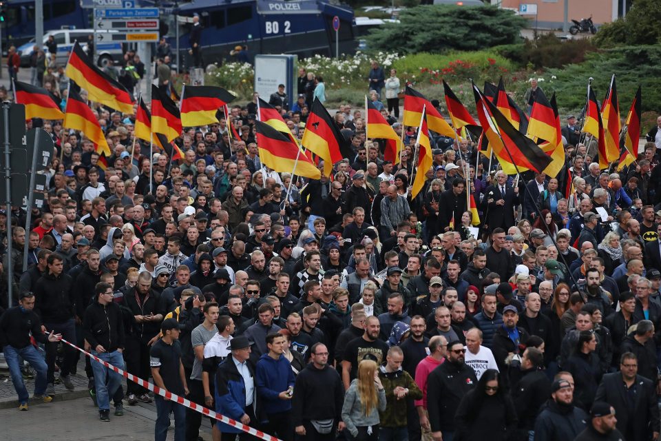  People hold German flags as they take part in a march in 