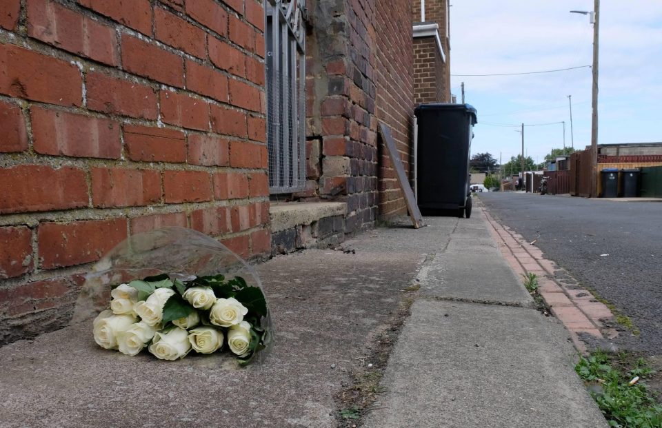  Flowers were laid on the residential street where the victim was pronounced dead last night