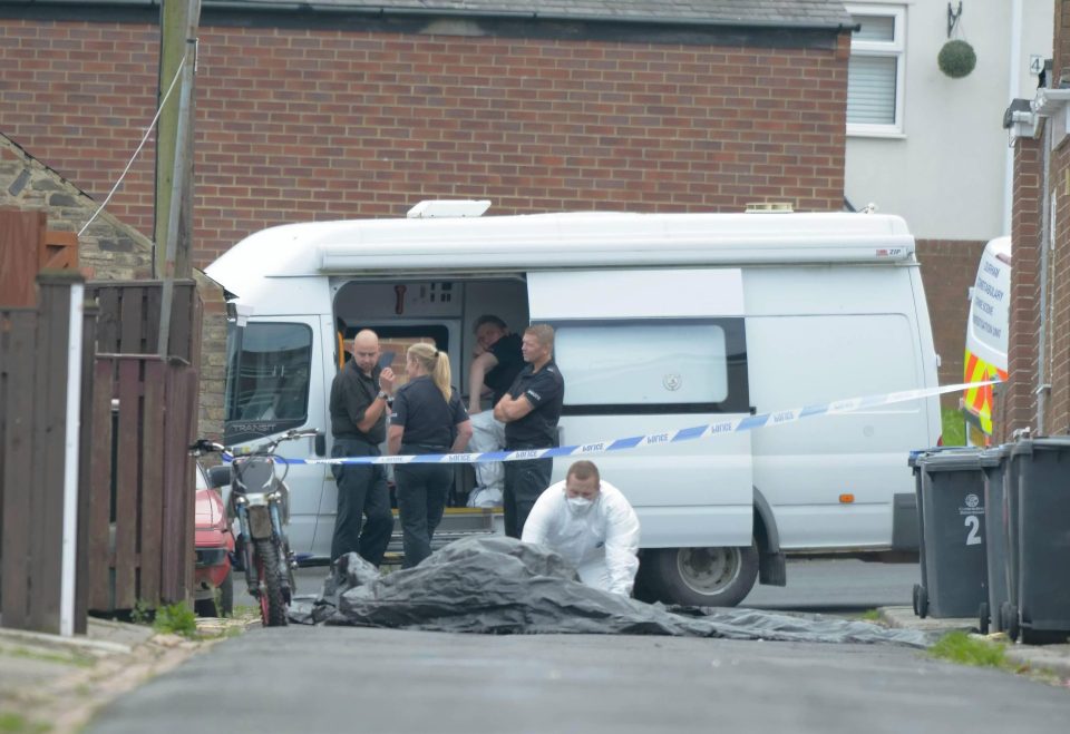  Officers cordoned off the area as they scoured the street for evidence