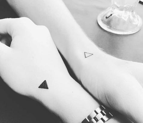  Let's hope these tatts don't signify a love triangle