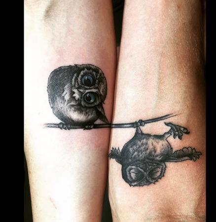  A pair of owls seems like an odd choice for a tattoo