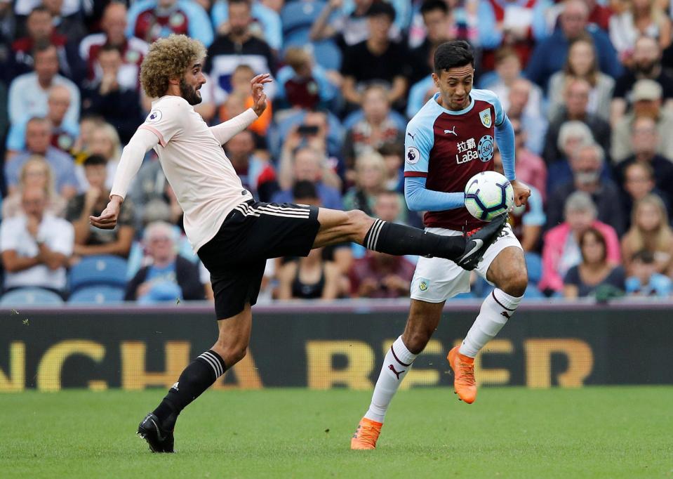  Fellaini stretches to beat Dwight McNeil to a ball in the 2-0 victory