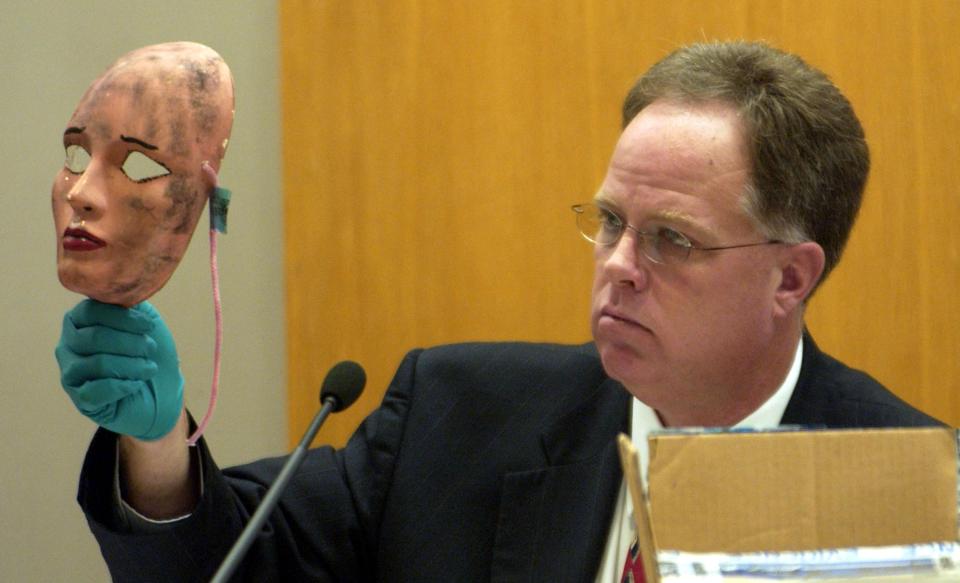  Wichita Police Det. Sam Houston shows a mask during the sentencing hearing that Rader placed on one of his victims