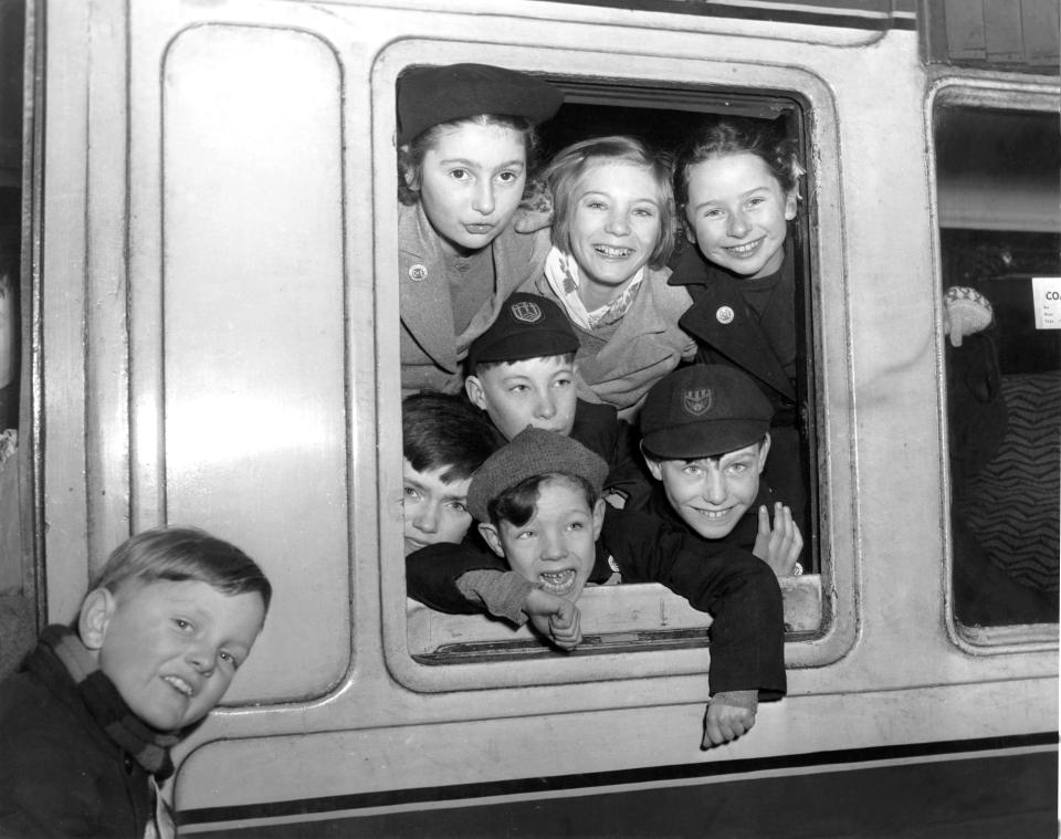  A group of children at their window of a train at St Pancras station, bound for Australia all travelling on the Free and Assisted Passages Scheme