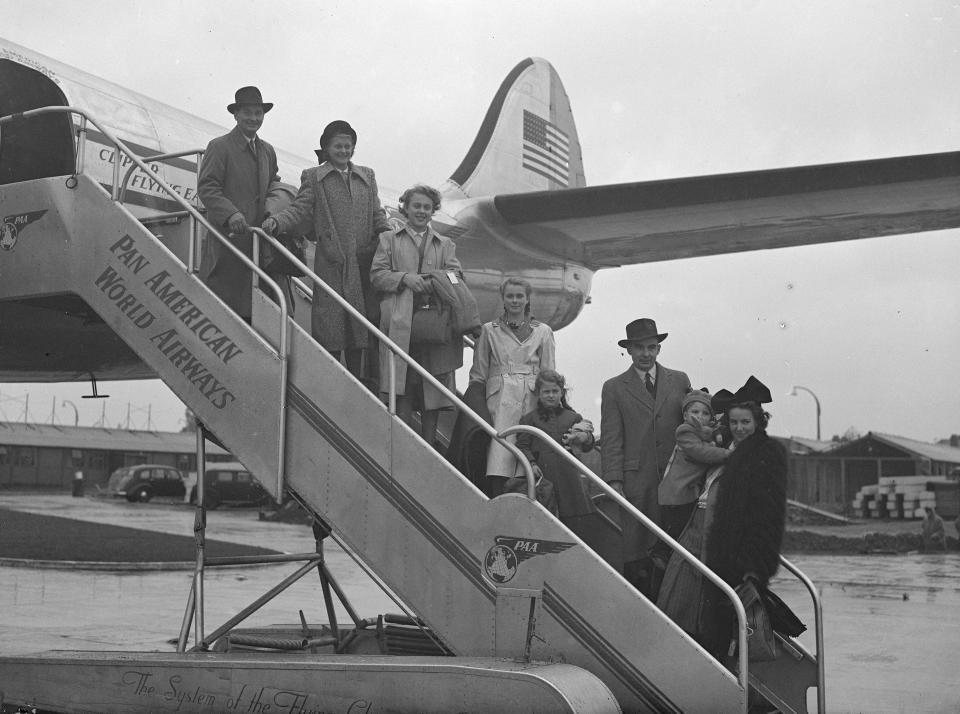  Members of the Braine family boarding their plane before the start of their 6,000-mile flight