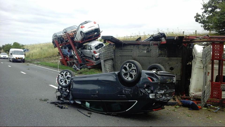  The lorry threw two of the cars it was transporting on to the road, with the driver amazingly suffering only minor injuries in the crash