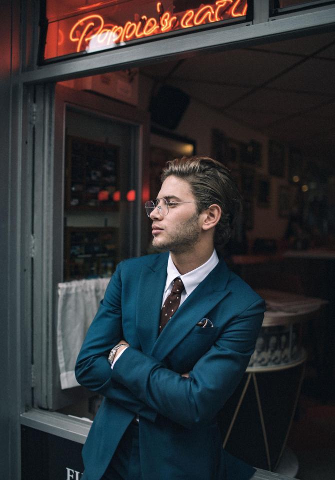 He also modelled a blue suit, jazzed up by a spotted tie and geeky glasses