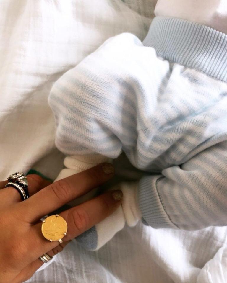  Vogue announced the birth of their little one with a cute snap of his dainty feet