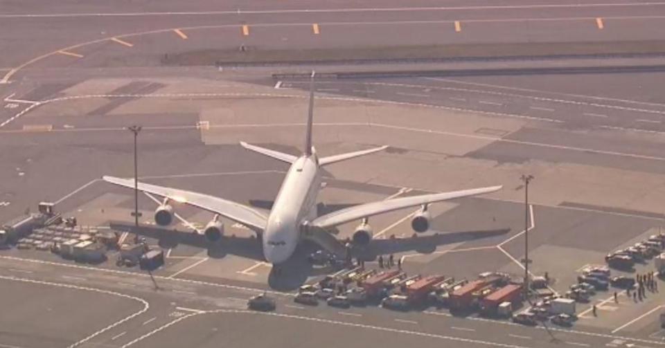  Above, the plane is pictured being quarantined at JFK