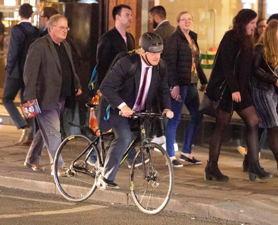  Boris Johnson jumps on his bike on the way home from The Gielgud Theatre