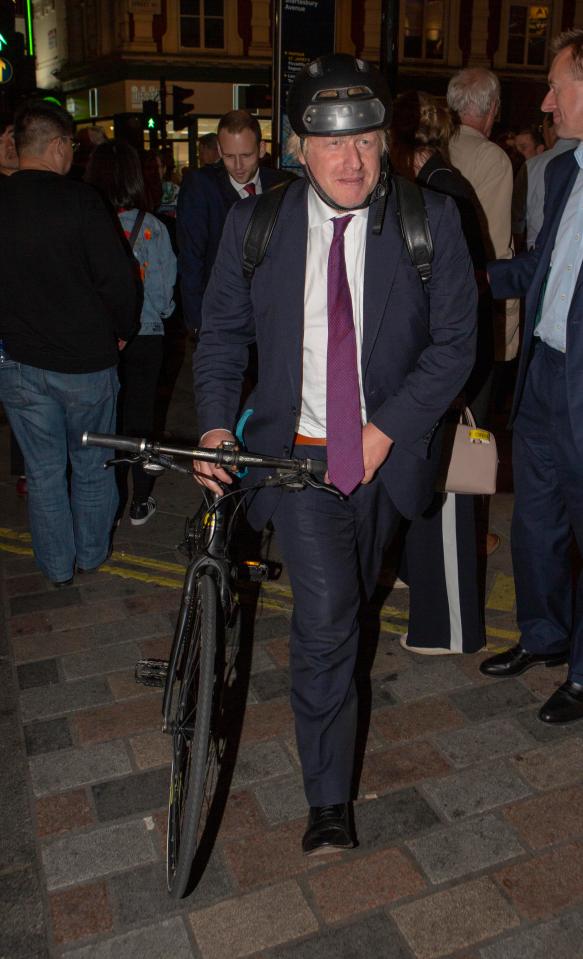  Boris Johnson wheels his bike through Central London as our story breaks about his affair claims