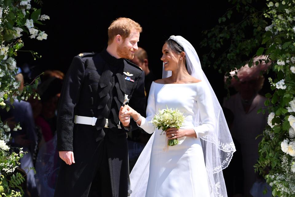  Meghan's veil was a nod to the Queen, who also wore a long veil embroidered with flowers at her wedding in 1947