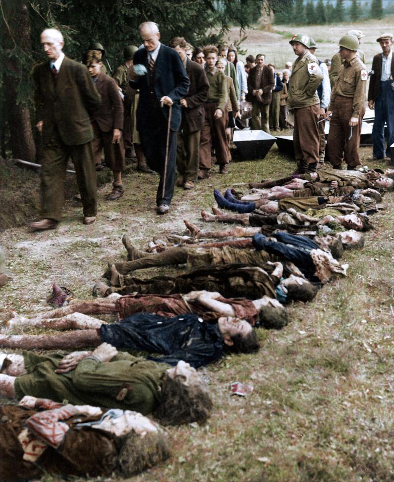  Home truths... American soldiers force German civilians from the town of Volary to walk past a group exhumed bodies of 30 Jewish women starved to death by SS troops