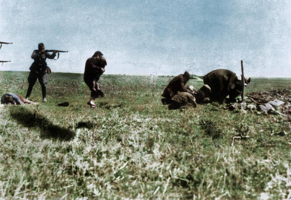  Executions of Jews by German army mobile killing units, the Einsatzgruppen, after they had dug their own graves, near Ivangorod, Ukraine, 1942