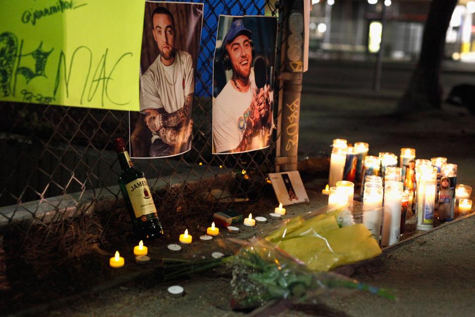  A makeshift memorial for late rapper Mac Miller appears at the corner of Fairfax and Melrose Avenues