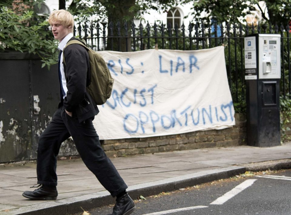  Milo was photographed on his way to school, going past an impromptu protest outside his home