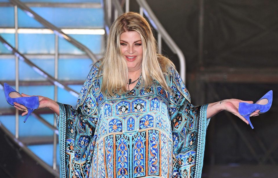  Kirstie Alley, who proudly shows off her blue heels, is proudly single now