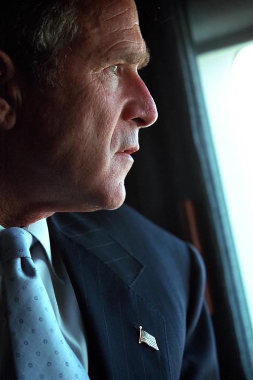  A troubled-looking president looks out of the window of Air Force One