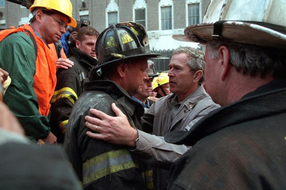  George W Bush meets with some of the firefighters at the site of the World Trade Centre