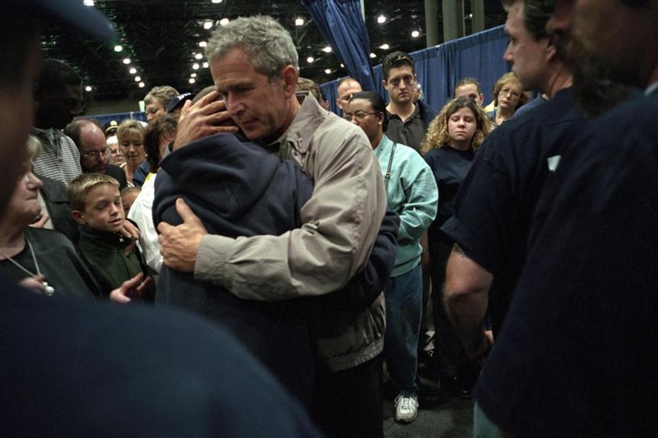  Bush consoles a family member who lost a loved one in the terror attacks