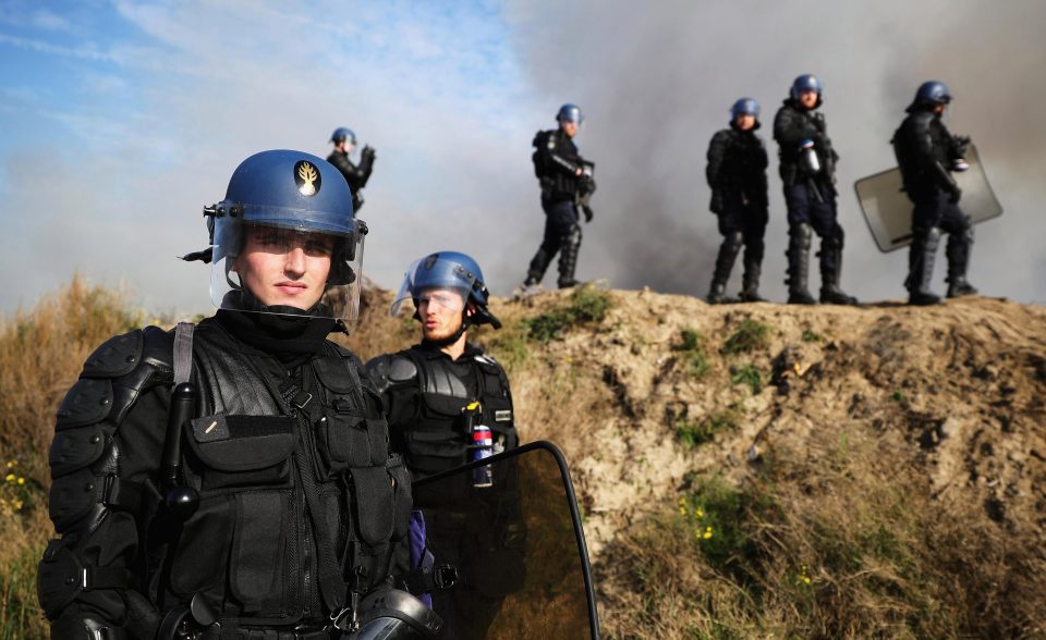  Police stand guard outside the notorious camp in 2016