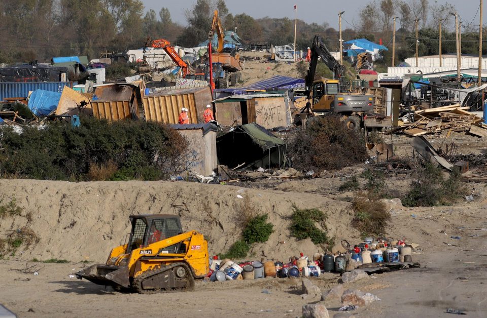  Large parts of the Calais 'Jungle' migrant camp are cleared by contractors