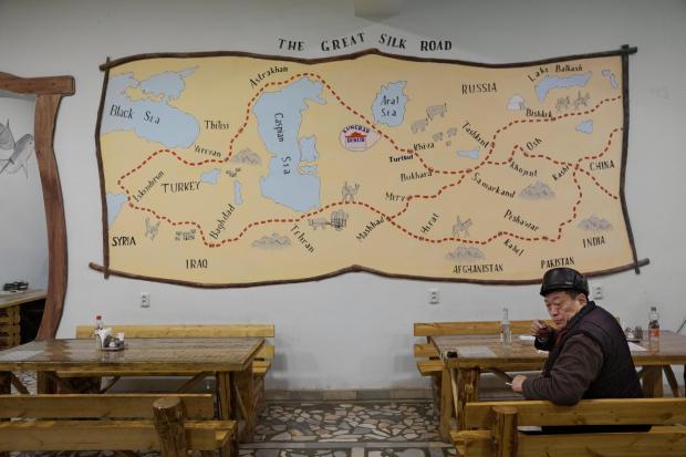 A map of the Silk Road hangs in a restaurant near Qongirot, Uzbekistan