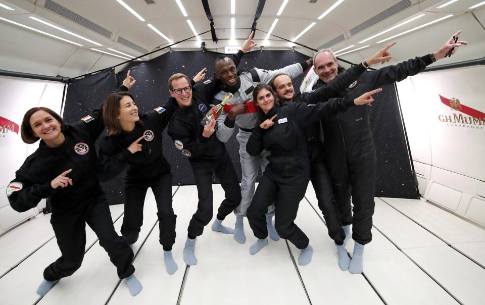 Sprinter turned footballer Usain Bolt helps his astronautical colleagues strike a pose - even without gravity 