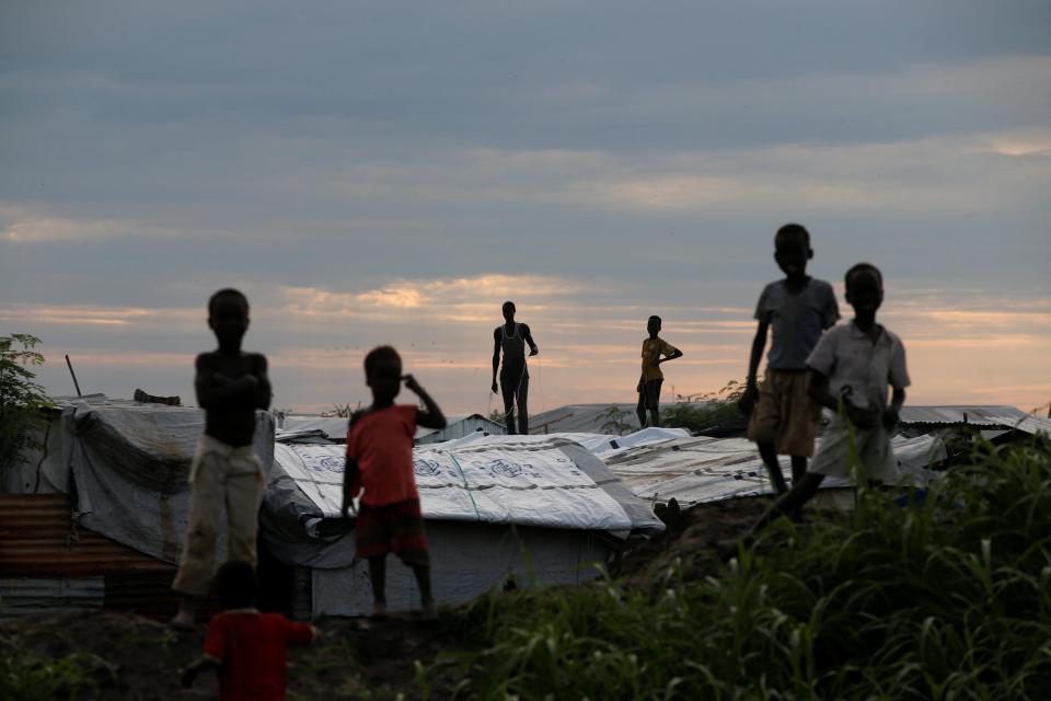  Kids sand on the roofs in a UN camp in South Sudan near the town of Malakal