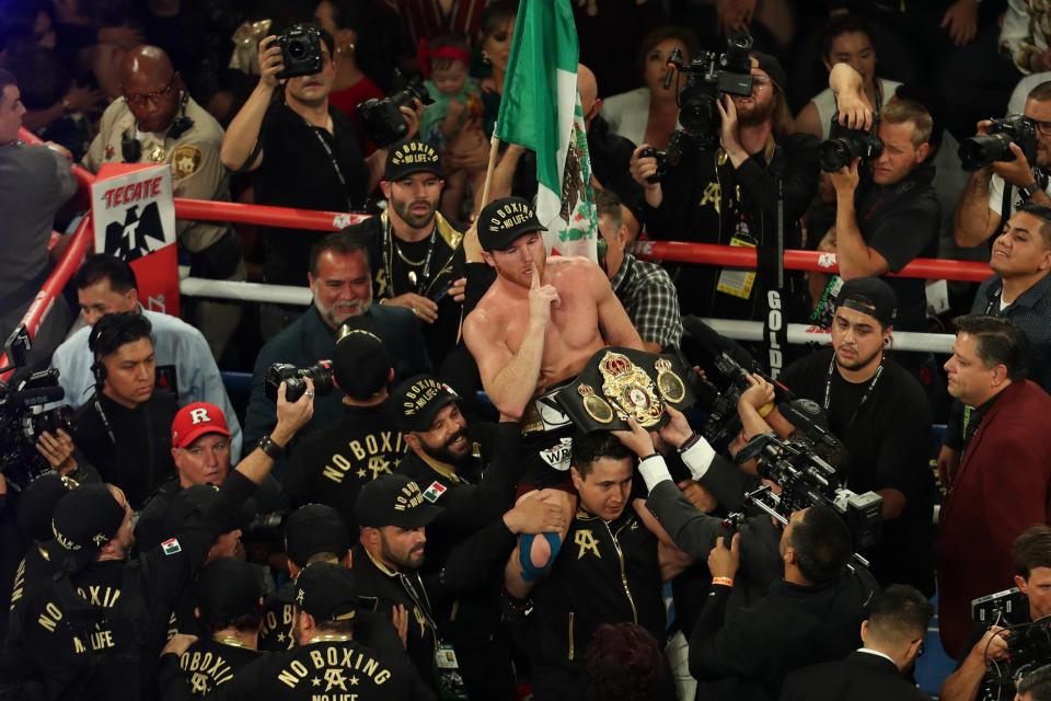 Canelo Alvarez celebrates after the final bell