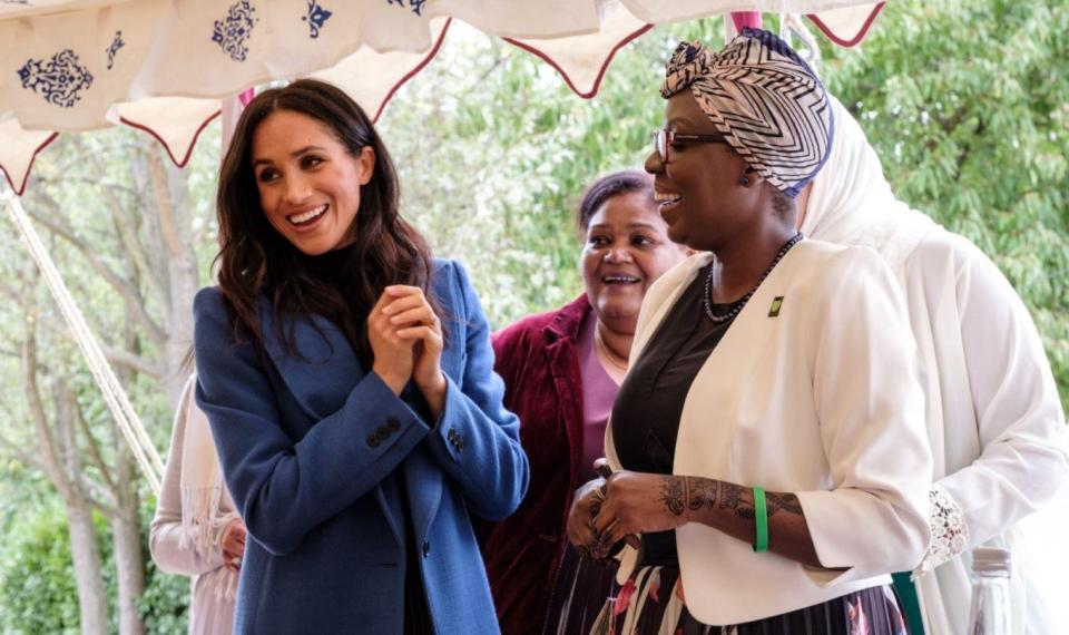  Meghan injected a bit of colour into her all-black ensemble with a stunning blue coat from Canadian brand Smythe