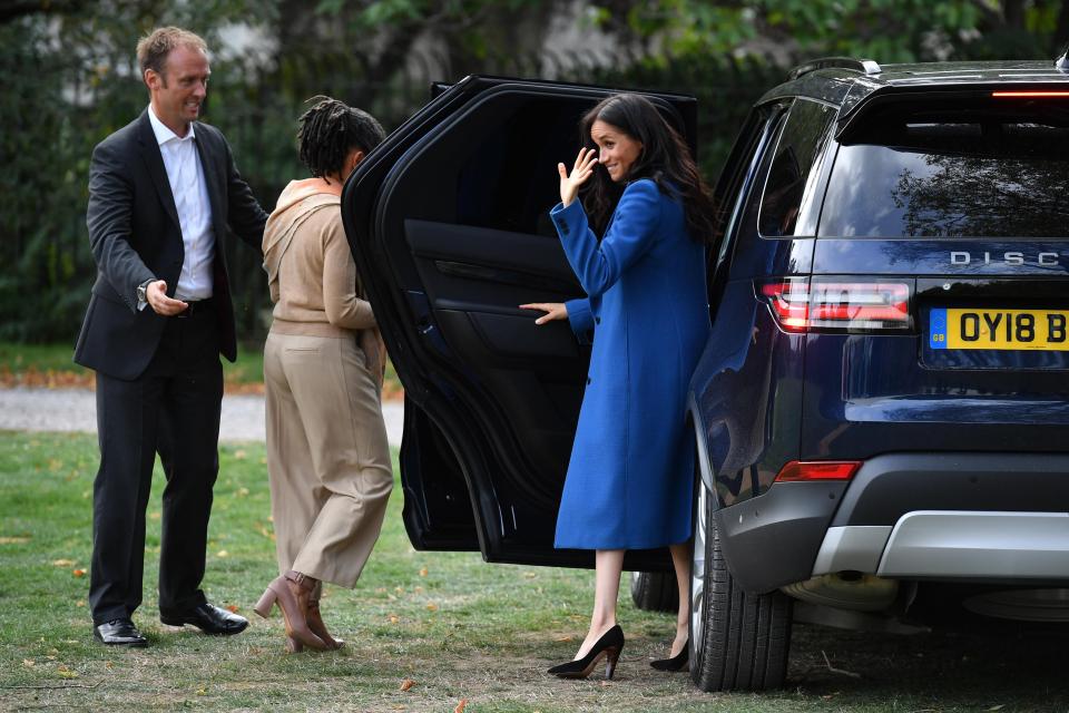  Meghan waved goodbye to the group as she departed with her mum and Prince Harry