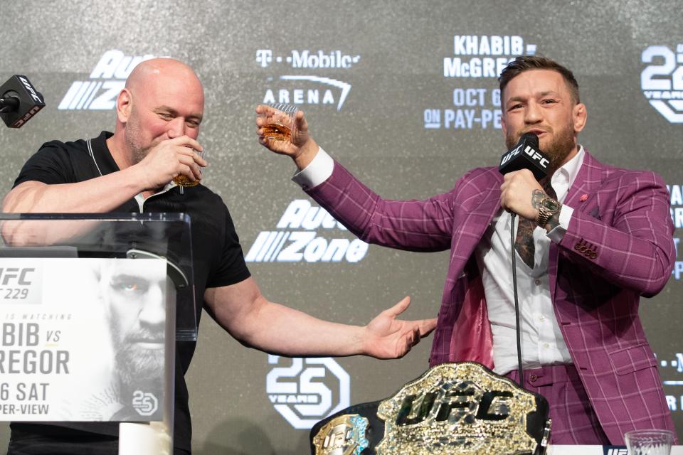  Conor McGregor has a drink with UFC chief Dana White