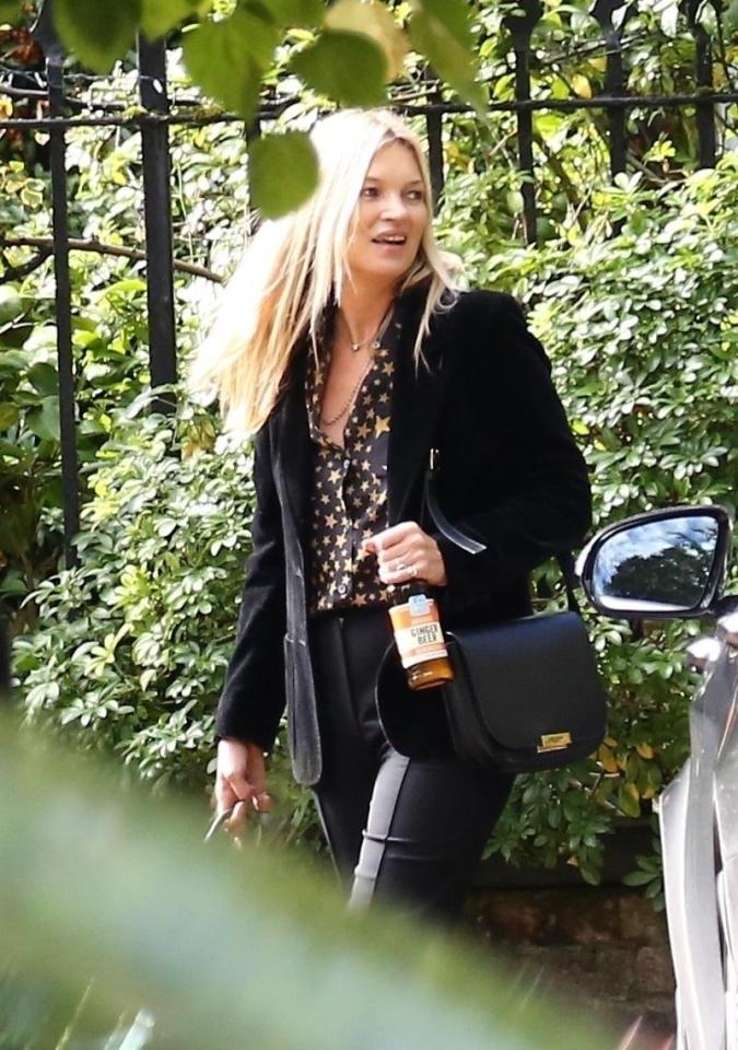  Kate Moss was seen leaving her home on Sunday clutching a ginger beer