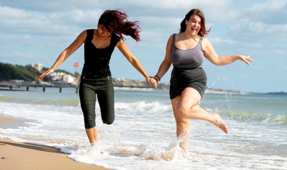  Two girls splash in the sea at Bournemouth yesterday