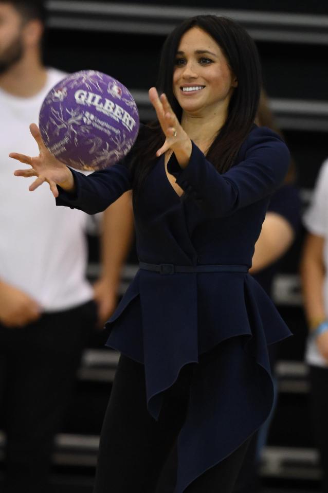  Meghan opted for an Oscar de la Renta blouse to hide her baby bump during a Royal visit to Loughborough University last month