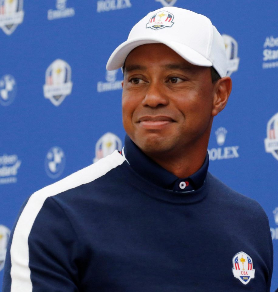  A smiling Tiger Woods faces the media at Le Golf National