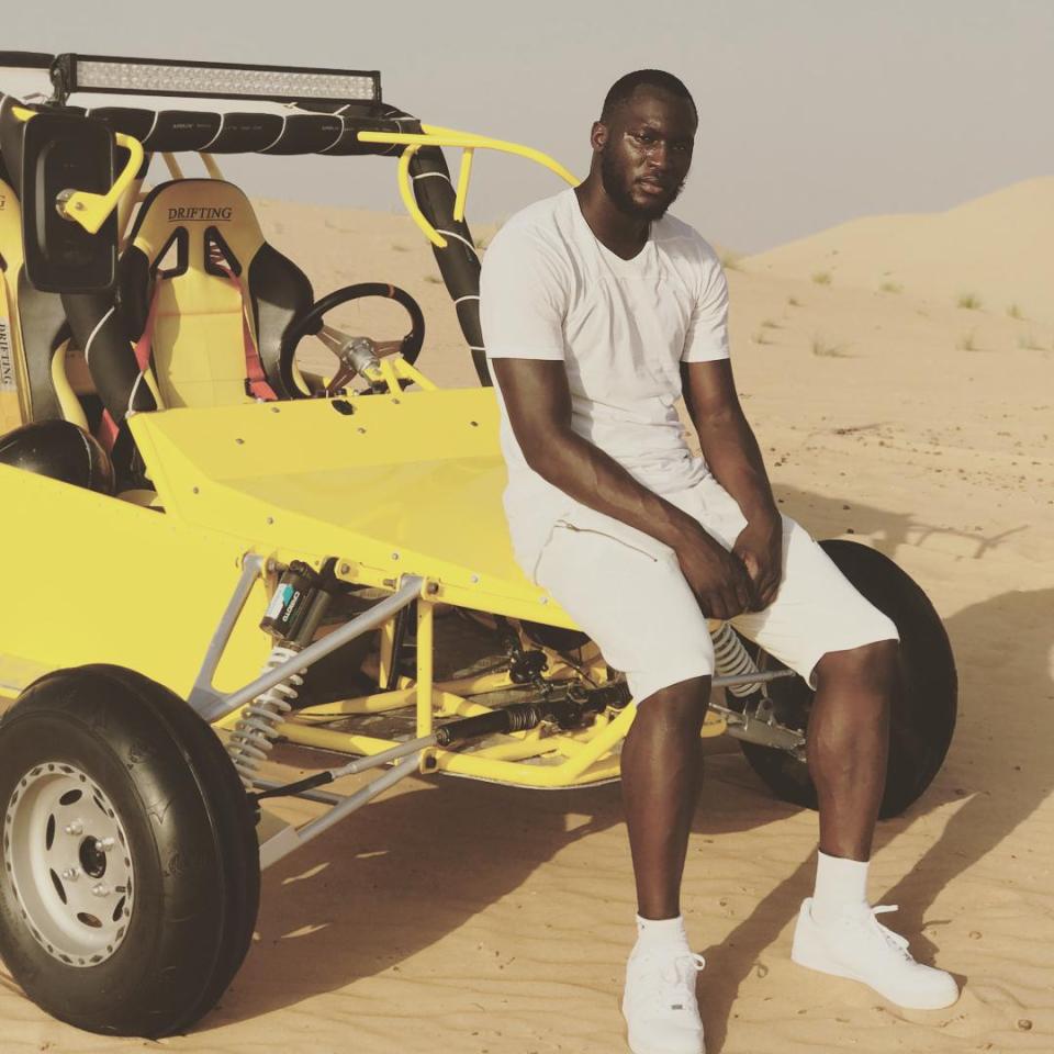  Lukaku poses next to a dune buggy while on holiday