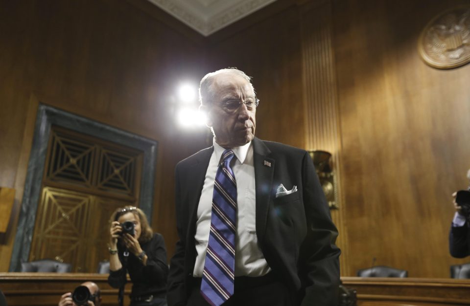  Republican Senator and chairman of the committee Chuck Grassley takes his seat