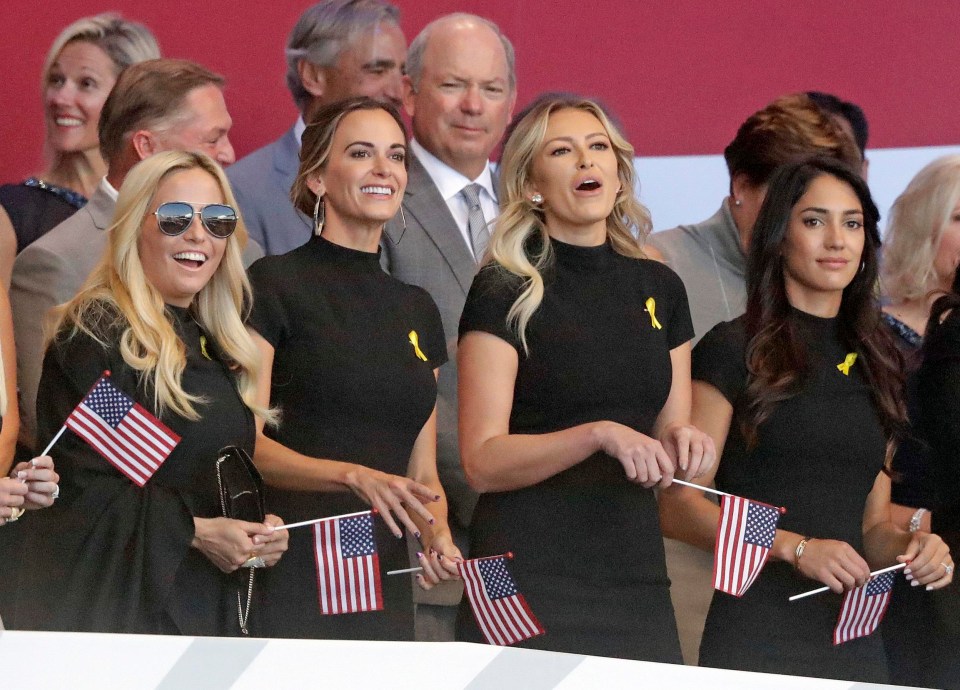 Team USA’s WAGs arrived armed with small flags to show their support