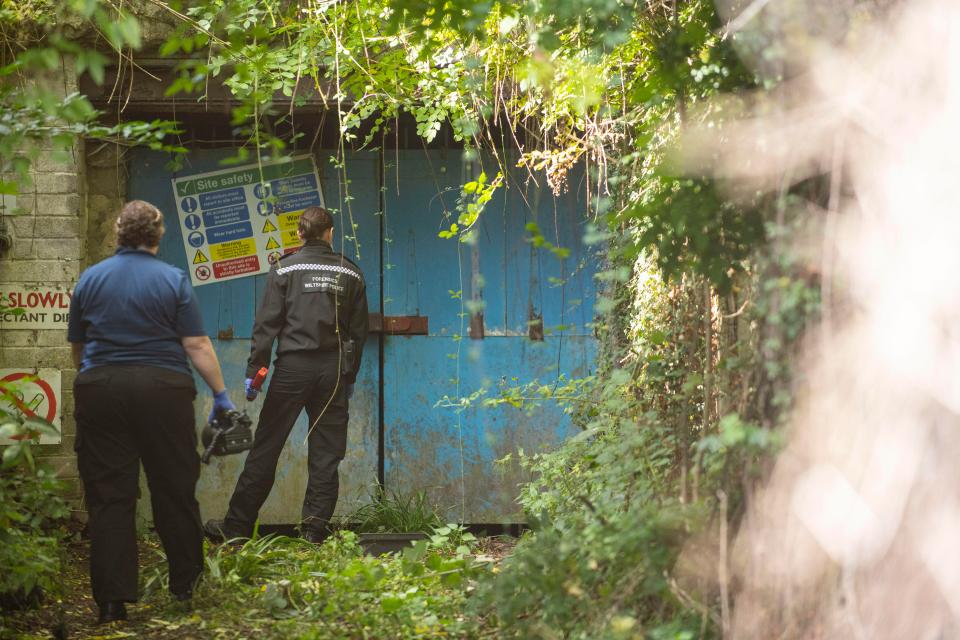  Police at the entrance to the Wiltshire quarry where the drug factory was discovered