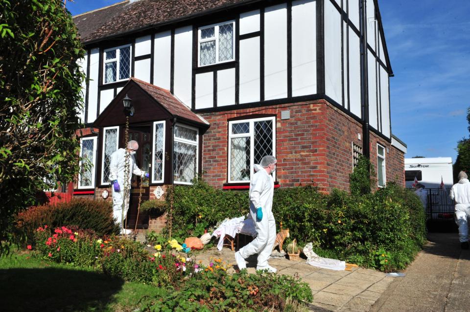  Forensics officers were seen examining a property yesteradmorning after police found two women dead