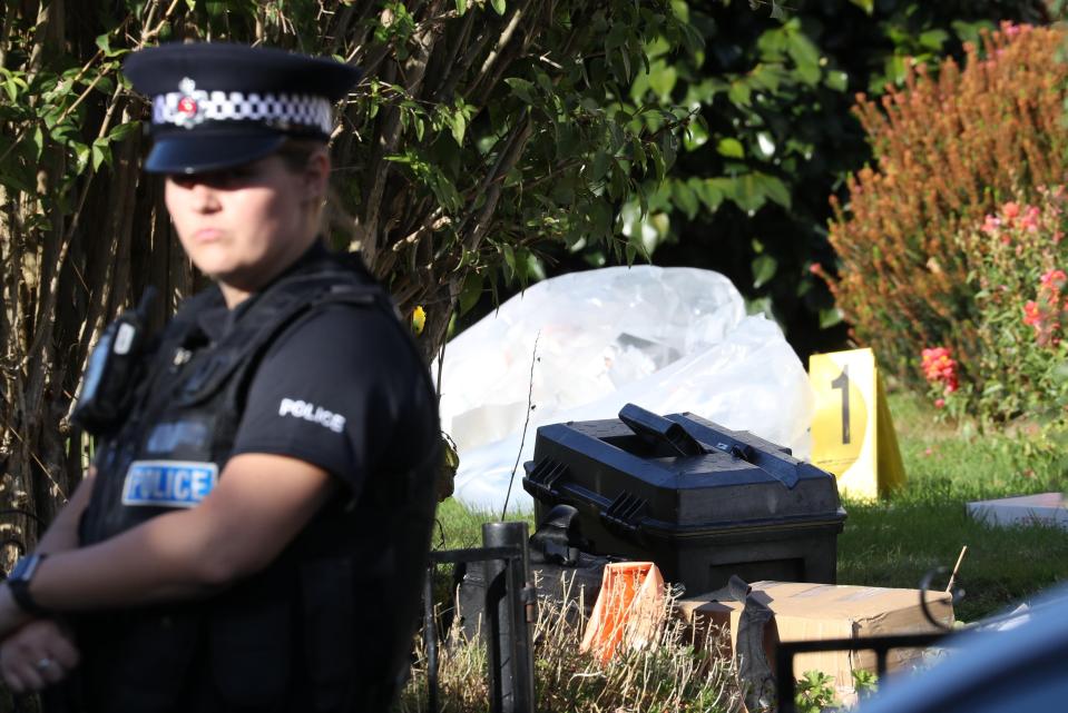  A police officer at the scene as forensics gets underway